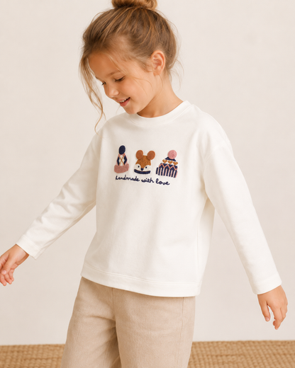 Blusa blanca manga larga detalle bordado 3D